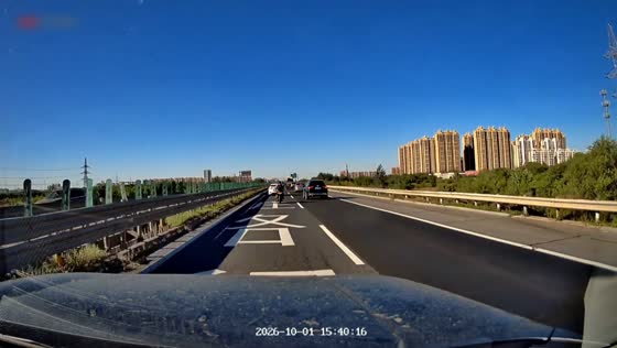 Motorcyclist is thrown into the air after crashing into a car on a highway in Tianjin, China