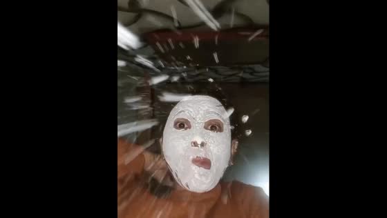 Removing the face mask in a funny way right into your phone's camera!