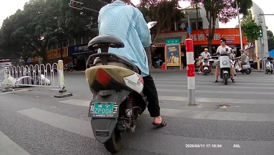 Car crashes into motorcycle at pedestrian crossing in Nanning, Guangxi, China