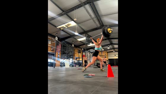 Weightlifter nearly loses balance during overhead lift in Nîmes, France