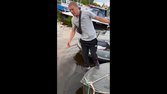 Man falls into lake while transferring between boats in Kimry, Russia
