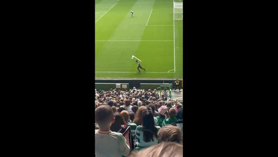 Fan falls while escaping after pitch invasion at Celtic Park in Glasgow, UK