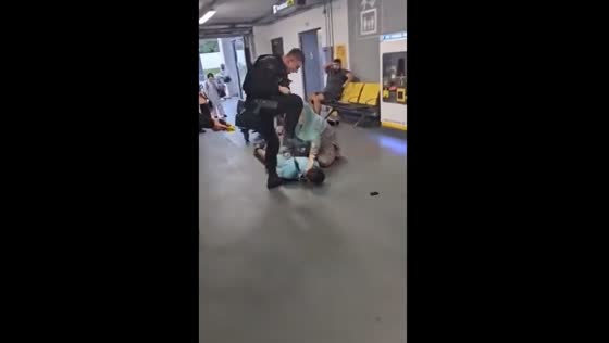 Videos show police beating civilians at Manchester Airport