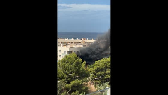 Thick black smoke billows from apartment fire near San Antonio Bay in Ibiza, Spain