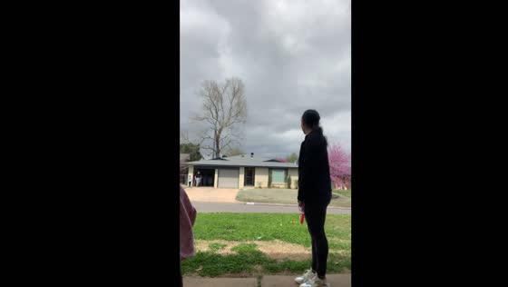 Child helps neighbor with trash in Oklahoma City