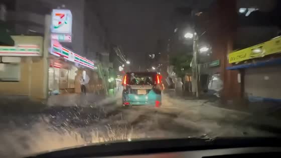 Deep floodwaters submerge streets as Typhoon Dujuan hits Ichikawa, Japan