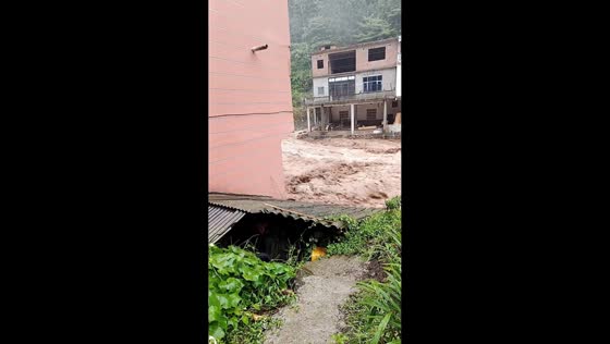 Flash flood washes away access paths near homes in Yunnan, China