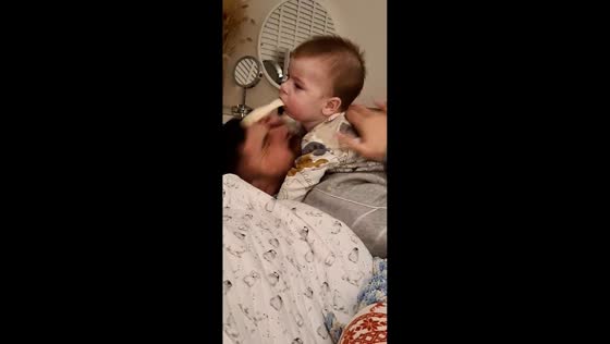 Child nearly pukes on father but he dodges just in time in Barrow-in-Furness, England, UK
