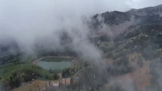 Low clouds engulf rugged mountains around Guardsman Pass in Utah, USA