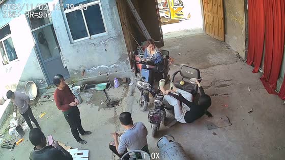 Young woman tips over while sitting on electric bike during cheerful gathering in Shandong, China.