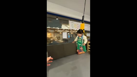 Little girl enjoys indoor zipline ride in Hwaseong-si, South Korea