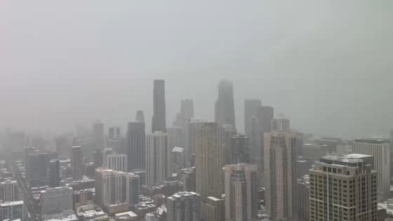 Heavy snowfall blankets rooftops and skyline in Highland, Indiana, USA
