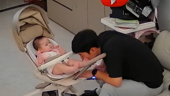 Baby playfully kicks father in the face in Guangdong, China