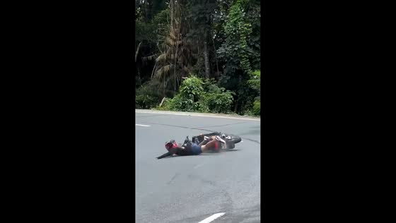 Motorcyclist crashes while cornering on Marilaque Highway in Tanay, Philippines