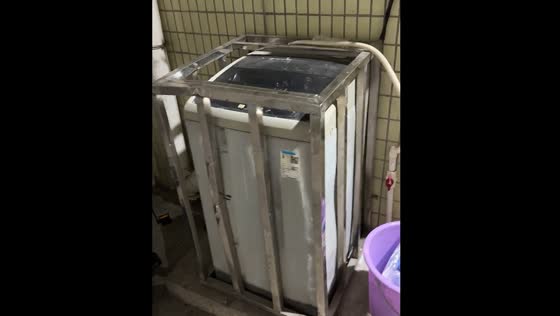 Washing machine moves inside a cage in Guangdong, China