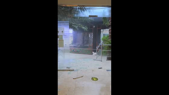 Glass door shattered during storm at hotel in Ajman, UAE