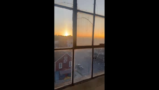 Sunrise shines through misted windows in Kingston, New York, USA