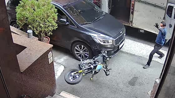 Car hits motorcycle on narrow road in Busan, South Korea