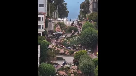 Motorcycles ride down Lombard St in San Francisco
