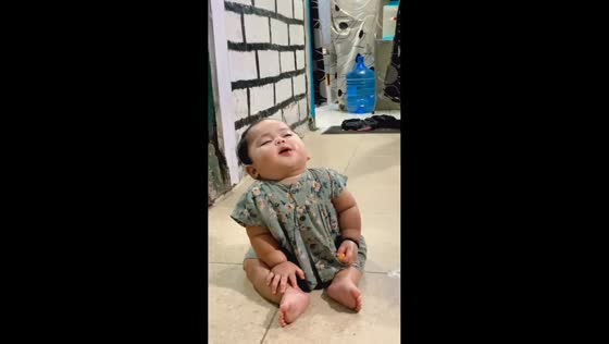 Sleepy toddler snacks while fighting drowsiness in Depok, Indonesia