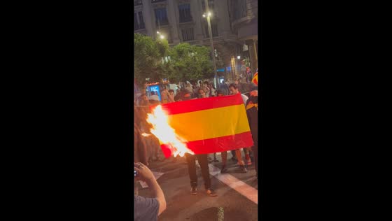 Spanish flag set on fire during pro-independence protest in Barcelona, Spain