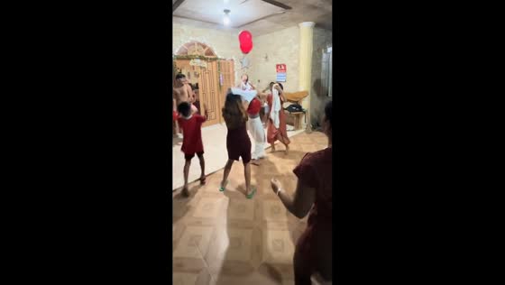 Family plays competitive balloon game in Cebu City, Philippines