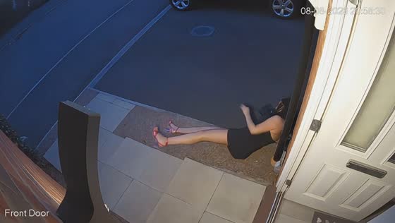 Tipsy woman has funny mishap on doorstep in Gloucester, England, UK