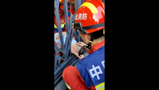 Firefighters rescue child trapped between metal gate bars in Hubei, China