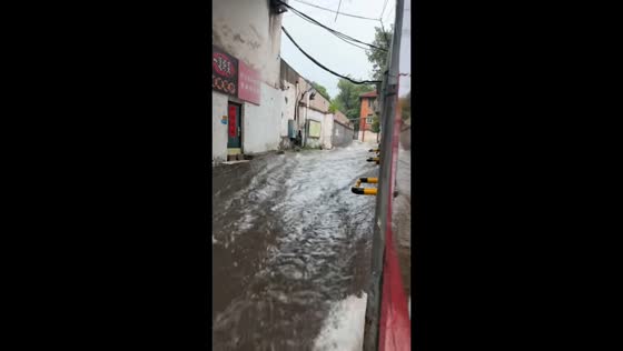 Severe flooding covers a street in Jinan, Shandong, China