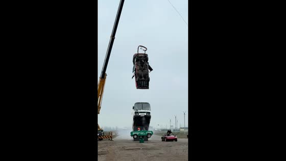 Man performs dangerous challenge involving bus and falling car in Rostov-on-Don, Russia