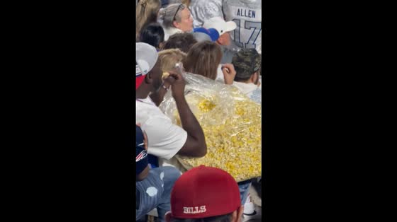Fan brings giant bag of popcorn to Buffalo Bills game in Buffalo, New York, US