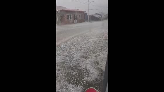 Heavy hailstorm covers streets and rooftops in Zhuanghe, China