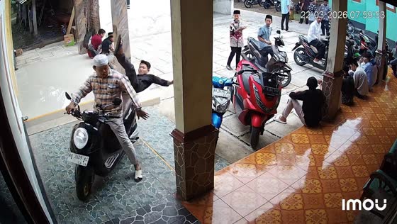 Motorcycle passenger tumbles off in funny mishap in Yogyakarta, Indonesia