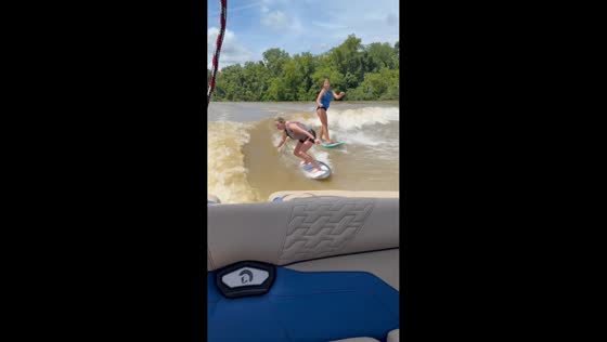 Mother and daughter showcase contrasting wakesurfing moments in Bay City, Texas, USA