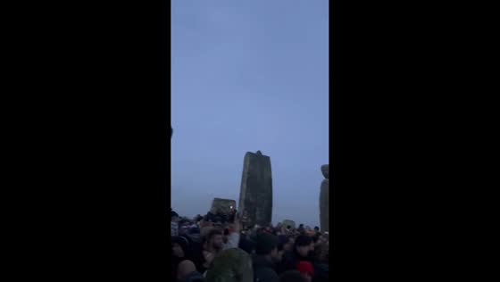 Winter Solstice sunrise illuminates Stonehenge in Wiltshire, UK