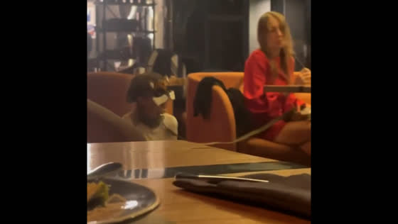 Woman seen walking daughter on leash in Moscow bar