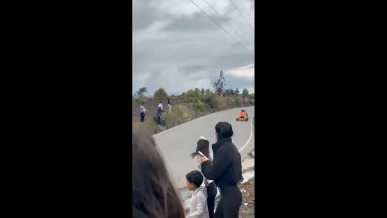 Makeshift motorized cart overturns on roadside in Guano, Ecuador