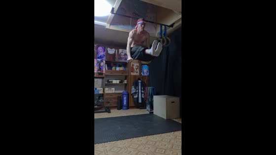 Man performs indoor calisthenics using pliers on wires in Russia