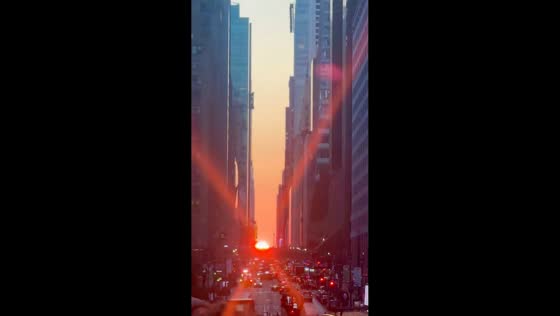 Crowds gather to watch stunning sunset in New York, USA