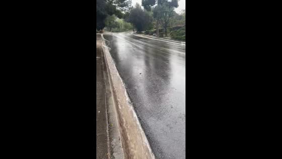 Heavy gutter runoff during continuous rainfall in Thousand Oaks, USA