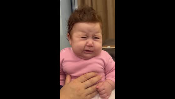 Baby cries as adults sing in Jounieh, Lebanon