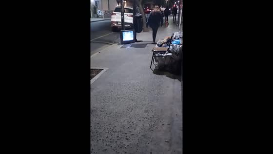 Person watching TV on the streets of Buenos Aires