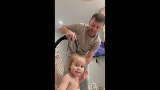 Father tries creative hair styling hack using vacuum hose in Stavropol, Russia