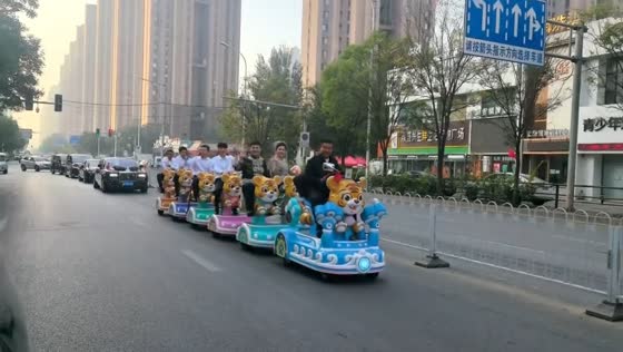 Unusual wedding procession with kiddie rides in Gansu, China