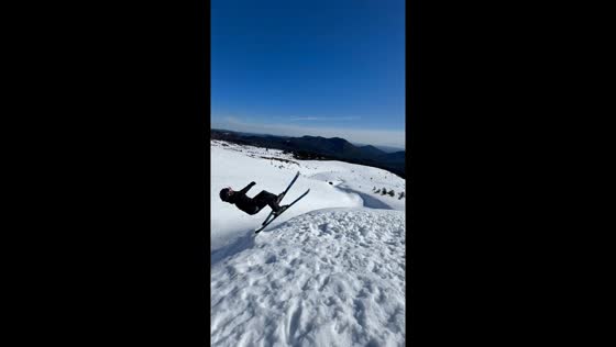 Skier falls during jump on snowy slope in Llaima, Chile