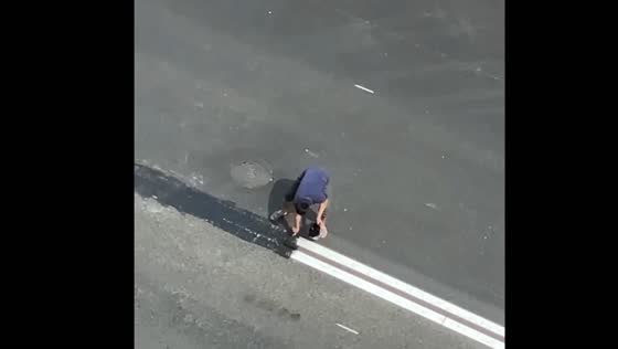 Migrant in Moscow caught painting over road lines for easier access to work site
