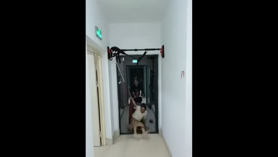 Improvised swing slips from workout bar in Hubei, China