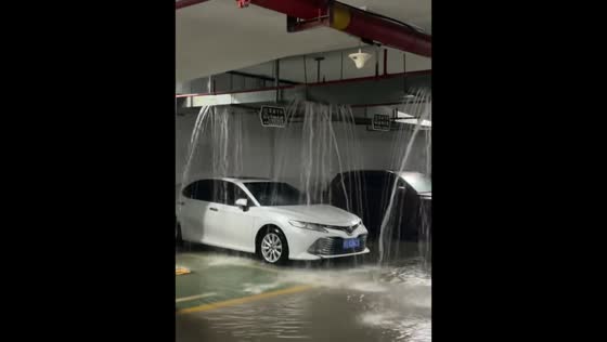 Severe ceiling leak floods parking area in Hubei, China