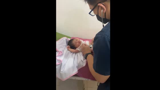 10-day-old Maria stuns with feisty gaze during doctor's exam