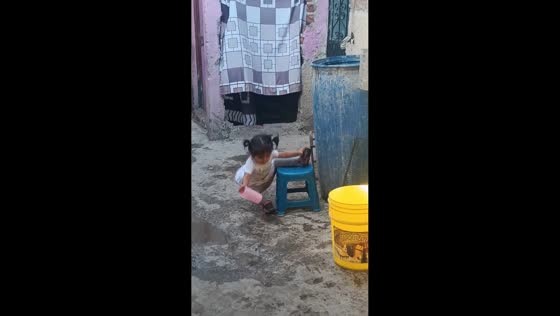 Toddler loses balance while climbing down from stool in Mexico